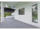 Modern outdoor kitchen with a pergola, offering a perfect blend of indoor-outdoor living with a beautiful lawn at 42157 Tamarac St, Eustis, FL 32736
