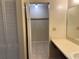 Bathroom features a vanity with a closet, tile flooring and neutral paint at 436 Hunter Cir, Kissimmee, FL 34758