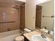 The bathroom features a tub with a shower, toilet, sink, and a large mirror to complete the space at 436 Hunter Cir, Kissimmee, FL 34758