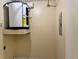 This utility room includes a water heater, electrical panel and plenty of space for storage or cleaning at 436 Hunter Cir, Kissimmee, FL 34758