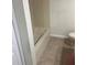 Bathroom featuring shower-tub combo, neutral paint, and tile floor at 454 Wilton Cir, Sanford, FL 32773