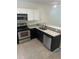 Kitchen features stainless steel appliances and granite countertops at 454 Wilton Cir, Sanford, FL 32773