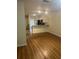 Bright living room with laminate flooring, opening to kitchen with granite countertops at 454 Wilton Cir, Sanford, FL 32773