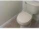 Toilet featuring a tile floor in a neutral-colored bathroom at 454 Wilton Cir, Sanford, FL 32773