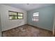 Bedroom with multiple windows providing ample natural light, ready for custom finishes at 535 Romano Ave, Orlando, FL 32807