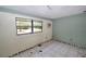 Bedroom featuring ceramic tile flooring, closet, and a window unit at 535 Romano Ave, Orlando, FL 32807