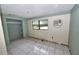 Bedroom featuring ceramic tile flooring, closet, and a window unit at 535 Romano Ave, Orlando, FL 32807