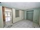 Sunlit living room featuring ceramic tile flooring and an open layout at 535 Romano Ave, Orlando, FL 32807
