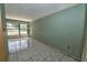 Living room with tile floors and natural light, offering remodeling potential at 535 Romano Ave, Orlando, FL 32807
