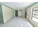 Spacious living room with ceramic tile flooring and an open layout at 535 Romano Ave, Orlando, FL 32807