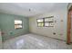 Room featuring windows and tile floors, waiting for creative renovation to create a welcoming space at 535 Romano Ave, Orlando, FL 32807