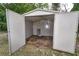 Empty shed with open doors, providing ample storage space and potential for various uses at 535 Romano Ave, Orlando, FL 32807