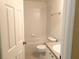 Cozy bathroom features a tub and shower combination, with a toilet and sink adjacent at 650 Shropshire Loop, Sanford, FL 32771