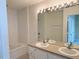 The bathroom offers double sinks with great lighting, plus a tub and shower at 650 Shropshire Loop, Sanford, FL 32771