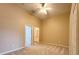 Spacious bedroom with a ceiling fan, carpet flooring, and access to the bathroom and closet at 650 Shropshire Loop, Sanford, FL 32771