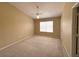 Bright bedroom with neutral walls, carpet flooring, ceiling fan, and a window for natural light at 650 Shropshire Loop, Sanford, FL 32771