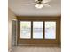 Bedroom with a ceiling fan and three windows offering views of water feature at 650 Shropshire Loop, Sanford, FL 32771