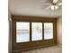 Bedroom featuring three windows with scenic water views and a ceiling fan at 650 Shropshire Loop, Sanford, FL 32771