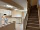Open kitchen features white cabinets, appliances, and a seamless flow to the living area at 650 Shropshire Loop, Sanford, FL 32771