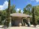 Mail kiosk with brick accents, set against a sunny blue sky with beautiful landscaping at 650 Shropshire Loop, Sanford, FL 32771