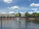 Scenic view of a tranquil pond with a fountain and lush greenery surrounding at 650 Shropshire Loop, Sanford, FL 32771