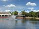 Scenic view of a tranquil pond with a fountain and lush greenery surrounding at 650 Shropshire Loop, Sanford, FL 32771