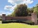 Welcoming entrance to Dunwoody Commons with lush landscaping at 650 Shropshire Loop, Sanford, FL 32771