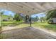 Backyard features a patio and partial view of surrounding properties at 814 Roseapple Ave, Lady Lake, FL 32159