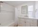 Bathroom features tub/shower and vanity with marble top at 814 Roseapple Ave, Lady Lake, FL 32159
