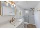 Bathroom features large mirror, shower, and vanity at 814 Roseapple Ave, Lady Lake, FL 32159