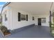 View of carport featuring painted concrete flooring and exterior storage for outdoor living at 814 Roseapple Ave, Lady Lake, FL 32159