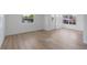 Bright living room with modern laminate flooring and lots of natural light at 814 Roseapple Ave, Lady Lake, FL 32159
