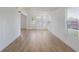 Bright and airy living room with laminate floors, and ample natural light at 814 Roseapple Ave, Lady Lake, FL 32159