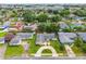 Wide aerial view of neighborhood with mature trees and manicured lawns at 830 Hawkes Ave, Orlando, FL 32809