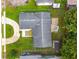 Birds eye view of property with a circle driveway, back patio with pergola, and a storage shed at 830 Hawkes Ave, Orlando, FL 32809