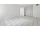 Bedroom featuring tile flooring and a closet with mirrored doors at 830 Hawkes Ave, Orlando, FL 32809