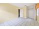 Bedroom featuring tiled floors, neutral walls, a closet, and natural light through a window at 830 Hawkes Ave, Orlando, FL 32809