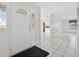 Bright foyer with tile flooring that leads into an open floor plan at 830 Hawkes Ave, Orlando, FL 32809