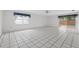 Spacious living room featuring tile flooring, a ceiling fan, and sliding glass doors to the outside at 830 Hawkes Ave, Orlando, FL 32809