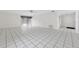 Large living area features tile floors and sliding glass doors leading to a large outdoor area at 830 Hawkes Ave, Orlando, FL 32809