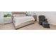Comfortable main bedroom with a king bed and a sitting area at 9027 Coral Cape St, Kissimmee, FL 34747