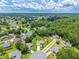Aerial view of a charming home nestled in a lush, green neighborhood at 909 Hendon Place, Kissimmee, FL 34758