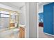 Bright bathroom with a glass enclosed shower and vanity at 909 Hendon Place, Kissimmee, FL 34758