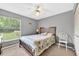 Cozy bedroom with a large window and bright natural light at 909 Hendon Place, Kissimmee, FL 34758