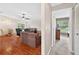 Open floor plan shows living and dining areas with hardwood floors at 909 Hendon Place, Kissimmee, FL 34758