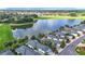 An aerial view showcasing the home's desirable location near a lake and golf course in a neighborhood at 1008 Jackson St, The Villages, FL 32162
