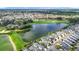 Breathtaking aerial view of the community showcasing homes with golf course and lake views at 1008 Jackson St, The Villages, FL 32162