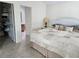 Cozy bedroom with a neutral color palette and an open closet at 1008 Jackson St, The Villages, FL 32162
