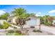 Charming single-story home with well-maintained landscaping, a two-car garage, and a welcoming entrance at 1008 Jackson St, The Villages, FL 32162