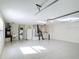 Spacious garage with laundry, utility sink and epoxy flooring at 1008 Jackson St, The Villages, FL 32162